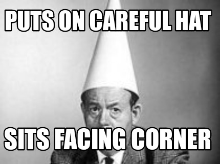 Meme Creator - Funny Puts on careful hat Sits facing corner Meme ...